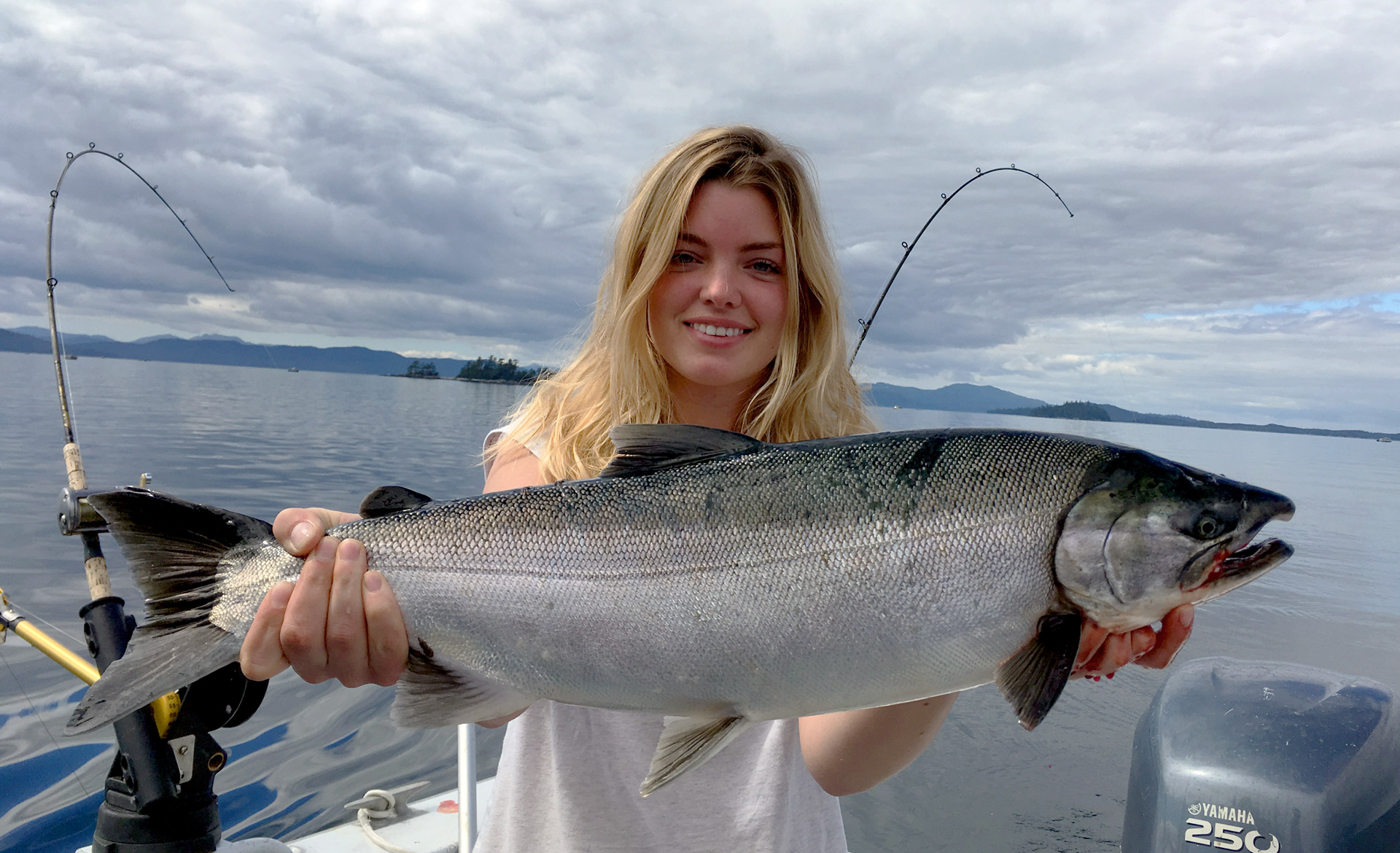 Ann Stevens presents Alaskan king salmon she caught on the Inside Passage at The Lodge at Whale Pass